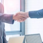 Businessmen shakes hands to agree on a forward contract in Ontario
