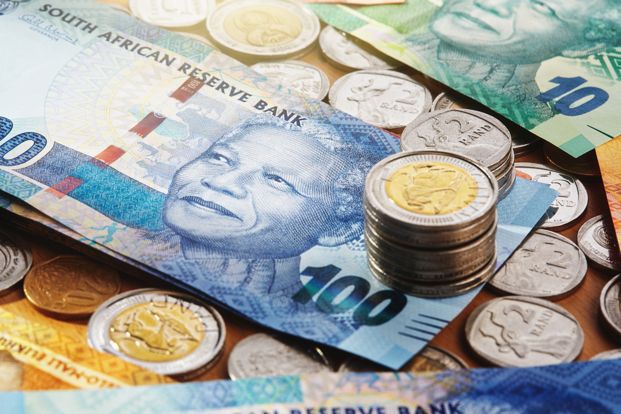 Group of South African coins and banknotes, the notes depicting Nelson Mandela.